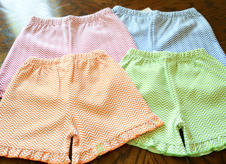 girl toddler,ruffle short, orange chevron